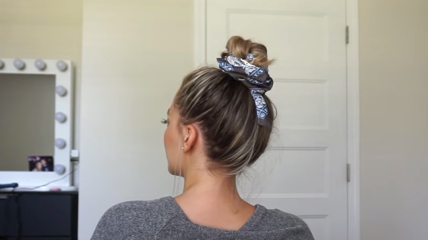 Messy top bun with a scarf