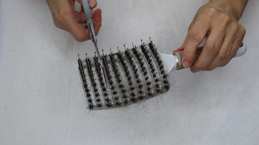 Remove any hair from the brush head
